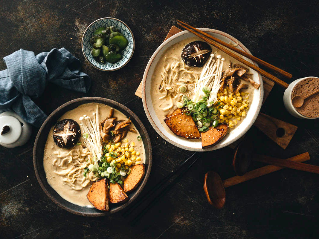Japanese vegan ramen containing enoki mushrooms, shiitake mushroom, noodles, scallions and corn.