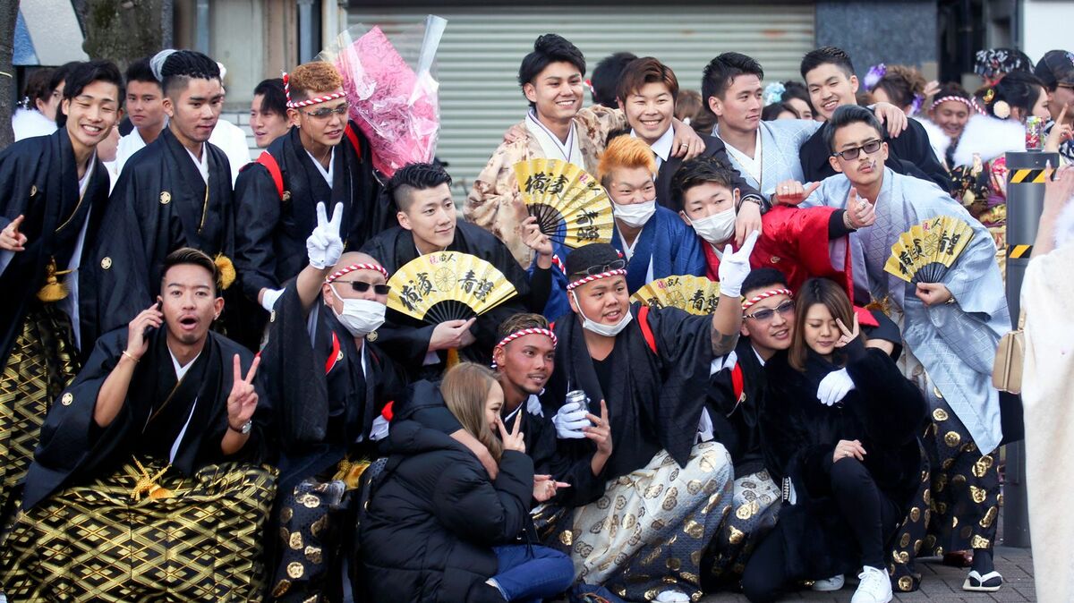 A group of young Japanese adults celebrating seijin no hi in haori and hakama.