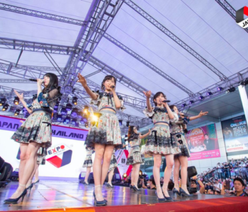 A jpop idol group performing on stage. Idol groups are an important part of the Japanese music industry.