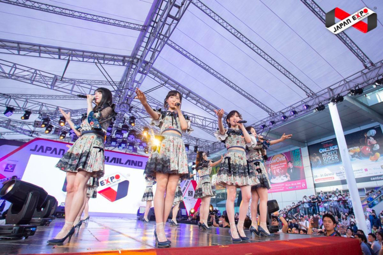 A jpop idol group performing on stage. Idol groups are an important part of the Japanese music industry.
